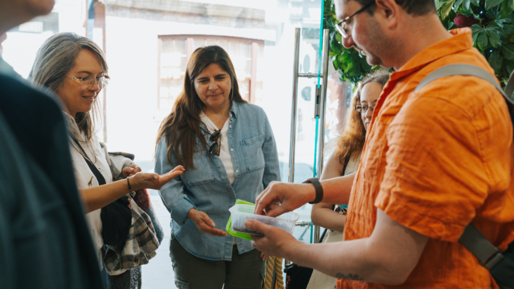 ben sharing food on the food tour